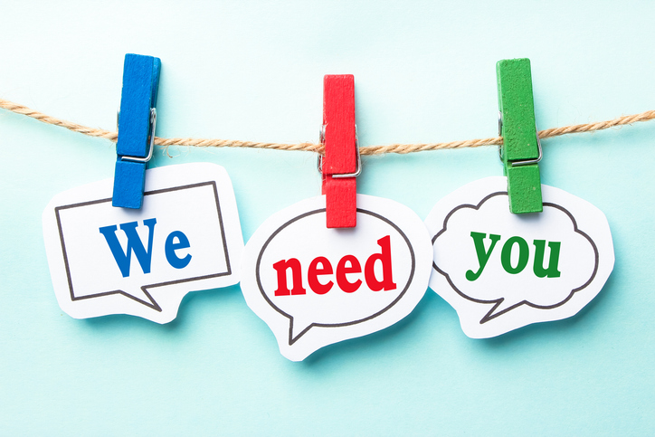 Holiday image of cards hanging from a clothesline with the message "We need you" symbolizing nonprofit support and year-end giving.